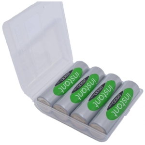 A clear plastic case holds four AA rechargeable batteries labeled "INSTANT 2500mAh." The batteries have a silver body with a green label featuring white and black text. The case is open, displaying the batteries neatly arranged inside.